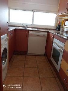 a kitchen with a sink and a dishwasher at Apartamento PUERTO REY 2 in Vera