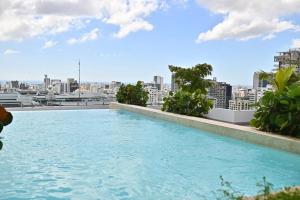 a swimming pool on the roof of a building at Piantini’s Skylight in Santo Domingo
