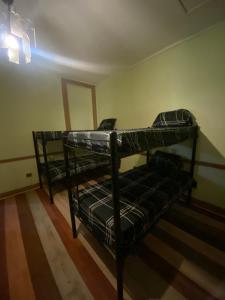 a bedroom with two bunk beds in a room at Viva Chile Santiago Centro in Santiago