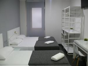 Postel nebo postele na pokoji v ubytování HOSTAL LETTO DAL MARE