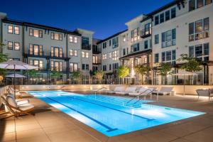 a swimming pool in front of a building at Locale Menlo Park in Menlo Park