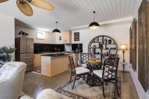 a kitchen and living room with a table and chairs at Shangri La in Goolwa South