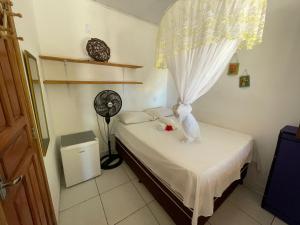 Postel nebo postele na pokoji v ubytování Quarto próximo à praia de Moreré
