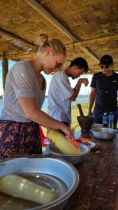 a group of people preparing food on a table at Vera Sunset homestay local experience with lao family in Muang Không +33 photos