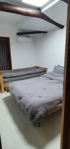 Voodi või voodid majutusasutuse Yachtie Inn Mokpo toas