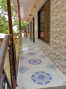 a tiled floor on a balcony of a house at Alpha House Matheran in Matheran