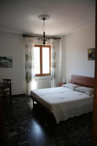 מיטה או מיטות בחדר ב-Agriturismo Costamagna