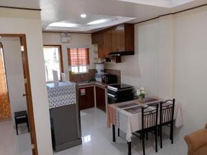 a small kitchen with a small table and a kitchen at MAYA HOMES VALENCIA in Valencia