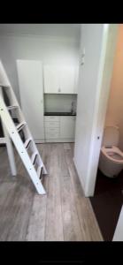 a room with two bunk beds and a toilet at Spirit of Bondi Apartments in Sydney