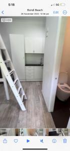 a bathroom with two bunk beds and a toilet at Spirit of Bondi Apartments in Sydney