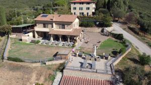 an aerial view of a large house with a yard at Bellavista Prile in Castiglione della Pescaia