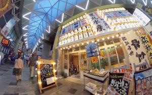 a shopping mall with people walking in front of it at Aoisora Aoiumi no guest house - Vacation STAY 74840v in Takamatsu
