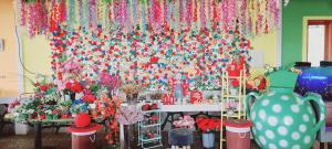 a room with a wall filled with flowers and vases at Curug Ciherang Villa & Glamping in Nangeleng +41 photos