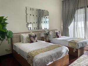 Postel nebo postele na pokoji v ubytování Anantara Hotel Apartment & Residences connected Anantara Hotel