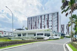a large building on the side of a street at RedLiving Apartemen Barsa City by Ciputra - WM Property in Yogyakarta