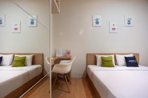 Postel nebo postele na pokoji v ubytování Urbanview Hotel Jagakarsa by RedDoorz