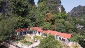an aerial view of a house in the mountains at Trang an green river homestay in Ninh Binh