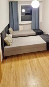 Postel nebo postele na pokoji v ubytování Apartament Zakątek - Centrum