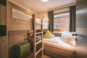 Ένα ή περισσότερα κρεβάτια σε δωμάτιο στο Boutique Hotel und Chalets Bergwiesenglück