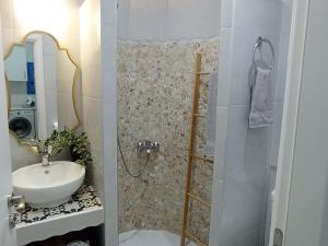 a small bathroom with a sink and a shower at Olympos Princess in Olympos +26 photos