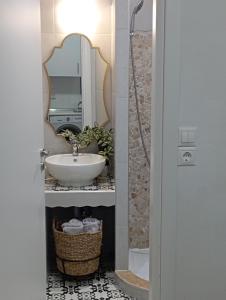 a bathroom with a sink and a mirror at Olympos Princess in Olympos