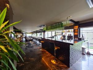 a bar in a restaurant with a lot of plants at Air Boss Istanbul Airport and Fair Hotel in Istanbul
