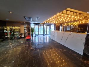 a store lobby with a bar with lights on it at Air Boss Istanbul Airport and Fair Hotel in Istanbul