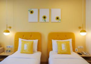 Postel nebo postele na pokoji v ubytování Bloom Hotel - Jalandhar