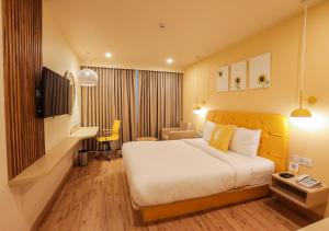 Postel nebo postele na pokoji v ubytování Bloom Hotel - Jalandhar