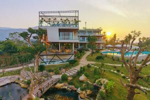 a hotel with a pool and a resort at Melody Retreat - Venuestay in Hòa Bình