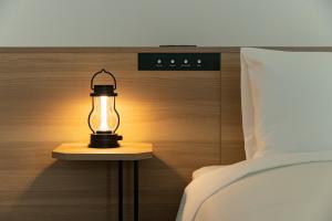 Postel nebo postele na pokoji v ubytování Tokyu Stay Shibuya Shin-Minamiguchi