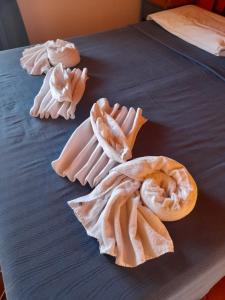 a blue bed with different types of food on it at Aziyz Camere in Castellammare del Golfo +52 photos