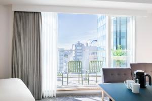 Postel nebo postele na pokoji v ubytování Tokyu Stay Shibuya Shin-Minamiguchi