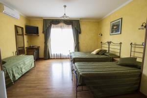 Postel nebo postele na pokoji v ubytování Hotel Internazionale