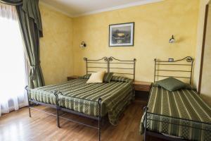 Postel nebo postele na pokoji v ubytování Hotel Internazionale