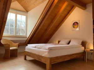 a bedroom with a bed in a attic at Old Town Loft & Central Location in Rapperswil in Rapperswil-Jona