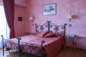Postel nebo postele na pokoji v ubytování Hotel Internazionale