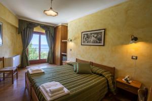 Postel nebo postele na pokoji v ubytování Hotel Internazionale