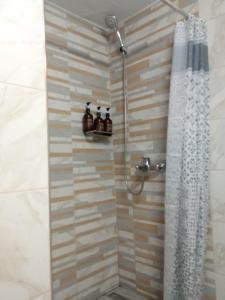 A bathroom at Olive - HappyHostGr - Downtown Apartment