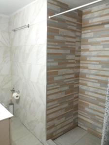 A bathroom at Olive - HappyHostGr - Downtown Apartment