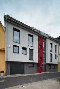 an apartment building with red and gray at Apartment Magnolia in Karlstadt