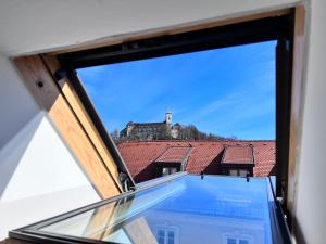 a window with a view of a castle at Castle View Palace Residence in Ljubljana