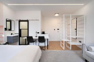 a bedroom with a bed and a table and chairs at D8 House in London
