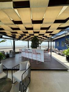 a patio with a table and chairs on a deck at A Scenic Escape within Nairobi in Nairobi