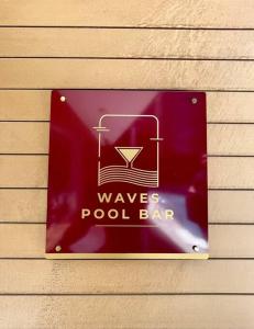 a sign that says waves pool bar on a building at A Scenic Escape within Nairobi in Nairobi