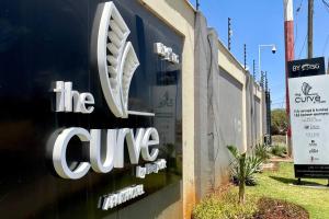 a sign on the side of a building at A Scenic Escape within Nairobi in Nairobi