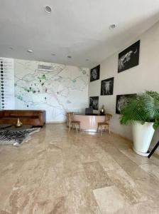 a lobby with a desk and a potted plant at A Scenic Escape within Nairobi in Nairobi
