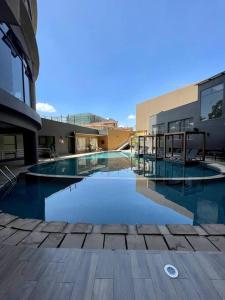 a swimming pool in a building with a frisbee at A Scenic Escape within Nairobi in Nairobi