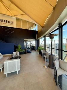 a lobby of a building with tables and chairs at A Scenic Escape within Nairobi in Nairobi