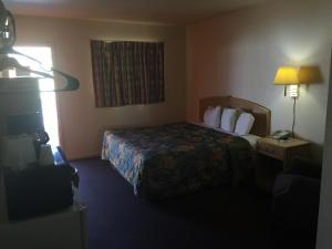 Postel nebo postele na pokoji v ubytování Avalon Motel